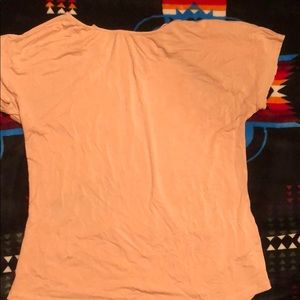 Tan shirt with back cutouts